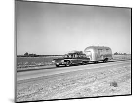 1960s-1970s Family Station Wagon and Camping Trailer Driving on Country Highway on Vacation-null-Mounted Photographic Print