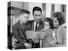 1960s FAMILY MOTHER FATHER SON DAUGHTER SITTING TOGETHER READING BIBLE INDOOR-Panoramic Images-Stretched Canvas