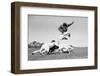 1960s FOOTBALL PLAYER JUMPING OVER BLOCKED PLAYERS-H. Armstrong Roberts-Framed Photographic Print