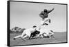1960s FOOTBALL PLAYER JUMPING OVER BLOCKED PLAYERS-H. Armstrong Roberts-Framed Stretched Canvas