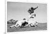 1960s FOOTBALL PLAYER JUMPING OVER BLOCKED PLAYERS-H. Armstrong Roberts-Framed Photographic Print