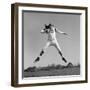 1960s QUARTERBACK JUMPING AND THROWING PASS FOOTBALL-H. Armstrong Roberts-Framed Photographic Print