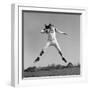 1960s QUARTERBACK JUMPING AND THROWING PASS FOOTBALL-H. Armstrong Roberts-Framed Photographic Print