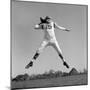 1960s QUARTERBACK JUMPING AND THROWING PASS FOOTBALL-H. Armstrong Roberts-Mounted Photographic Print