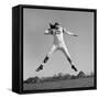 1960s QUARTERBACK JUMPING AND THROWING PASS FOOTBALL-H. Armstrong Roberts-Framed Stretched Canvas