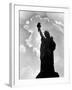 1960s Silhouette of Statue of Liberty with Sun Ray Clouds Behind-null-Framed Photographic Print