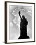 1960s Silhouette of Statue of Liberty with Sun Ray Clouds Behind-null-Framed Photographic Print