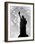 1960s Silhouette of Statue of Liberty with Sun Ray Clouds Behind-null-Framed Photographic Print