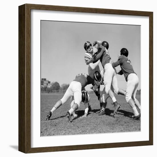 1960s SIX MEN PLAYING FOOTBALL GROUP TACKLE-H. Armstrong Roberts-Framed Photographic Print