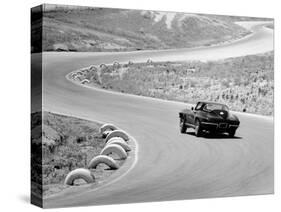 1964 Chevrolet Corvette Stingray on a Winding Racetrack, (C1964)-null-Stretched Canvas