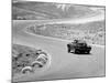 1964 Chevrolet Corvette Stingray on a Winding Racetrack, (C1964)-null-Mounted Photographic Print