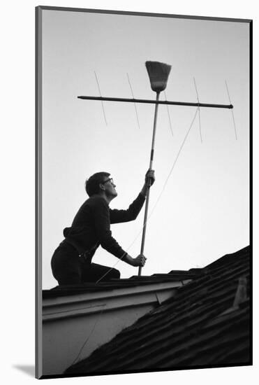 1967: Man Using a Broom to Improve the Antennae Reception During the Broadcast of Super Bowl I-Bill Ray-Mounted Photographic Print