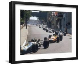 1968 Monaco Grand Prix, Jochen Rindt in Brabham leads Bruce McLaren in McLaren-Ford-null-Framed Premium Photographic Print