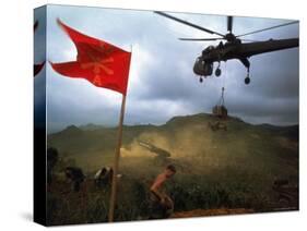 1st Air Cavalry Skycrane Helicopter Delivering Ammunition and Supplies to US Marines-Larry Burrows-Stretched Canvas