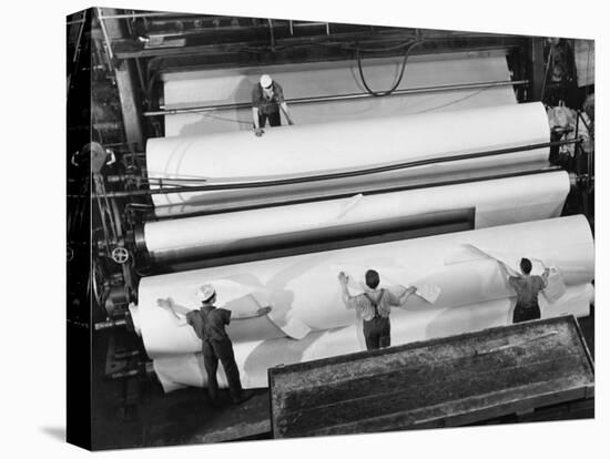 20 Ft. Roll of Finished Paper Arriving on the Rewinder, Ready to Be Cut and Shipped from Paper Mill-Margaret Bourke-White-Stretched Canvas