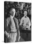 21 Club's Jack Kriendler Relaxing at Bar with Drink, Bartender Holding Bottle on Other Side of Bar-Eric Schaal-Stretched Canvas