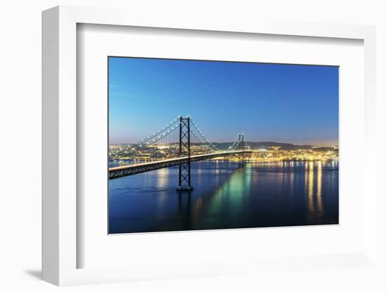 25th of April Bridge over the Tagus river (Tejo river) and Lisbon at twilight. Portugal-Mauricio Abreu-Framed Photographic Print