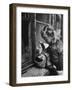 3 Year Old Child Playing with Doll on Window Sill of Apartment-Stan Wayman-Framed Photographic Print