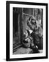 3 Year Old Child Playing with Doll on Window Sill of Apartment-Stan Wayman-Framed Photographic Print