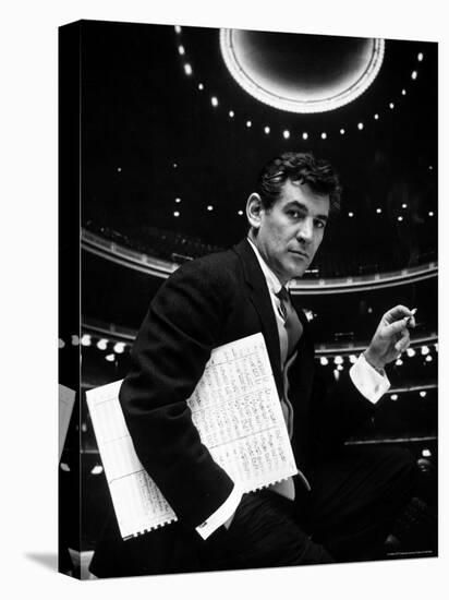 36 Year Old Composer Leonard Bernstein, Holding Musical Score with Lighted Auditorium Behind Him-Gordon Parks-Stretched Canvas