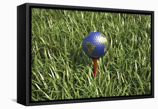 3D Rendering of an Earth Golf Ball on Tee in the Grass-null-Framed Stretched Canvas