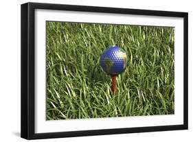 3D Rendering of an Earth Golf Ball on Tee in the Grass-null-Framed Art Print