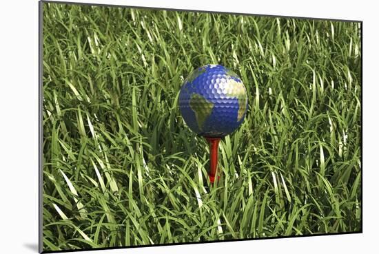 3D Rendering of an Earth Golf Ball on Tee in the Grass-null-Mounted Art Print