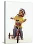 4 Year Old Boy Posing on His Tricycle, New York, New York, USA-Paul Sutton-Stretched Canvas