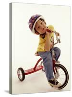 4 Year Old Boy Posing on His Tricycle, New York, New York, USA-Paul Sutton-Stretched Canvas