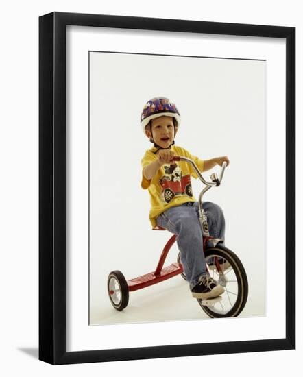 4 Year Old Boy Posing on His Tricycle, New York, New York, USA-Paul Sutton-Framed Photographic Print