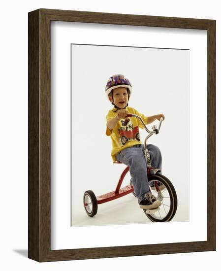 4 Year Old Boy Posing on His Tricycle, New York, New York, USA-Paul Sutton-Framed Photographic Print