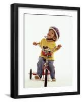 4 Year Old Boy Posing on His Tricycle, New York, New York, USA-Paul Sutton-Framed Photographic Print