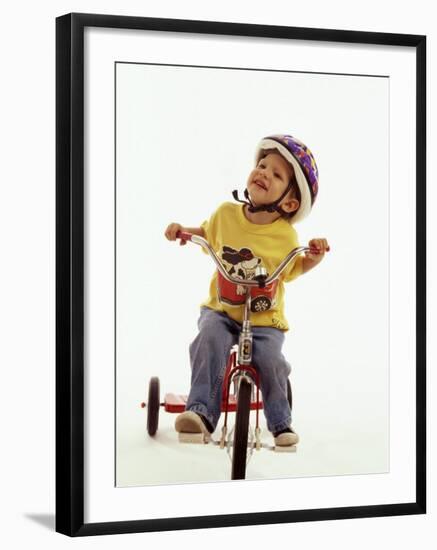 4 Year Old Boy Posing on His Tricycle, New York, New York, USA-Paul Sutton-Framed Photographic Print