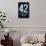 42 The Meaning of Life Poster-null-Framed Stretched Canvas displayed on a wall