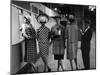 5 Models Wearing Fashionable Dress Suits at a Race Track Betting Window, at Roosevelt Raceway-Nina Leen-Mounted Photographic Print