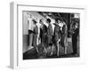 5 Models Wearing Fashionable Dress Suits at a Race Track Betting Window, at Roosevelt Raceway-Nina Leen-Framed Premium Photographic Print