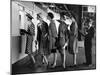 5 Models Wearing Fashionable Dress Suits at a Race Track Betting Window, at Roosevelt Raceway-Nina Leen-Mounted Premium Photographic Print