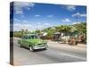 50s American Car Passing Ox and Cart, Pinar Del Rio Province, Cuba-Jon Arnold-Stretched Canvas