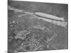 750 Foot Long Graf Zeppelin LZ 127 Flying Above British Capital-null-Mounted Photographic Print