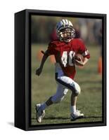 8 Year Old Boy Running with the Football-null-Framed Stretched Canvas