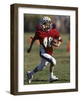 8 Year Old Boy Running with the Football-null-Framed Photographic Print