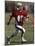 8 Year Old Boy Running with the Football-null-Mounted Photographic Print