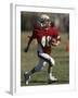 8 Year Old Boy Running with the Football-null-Framed Photographic Print