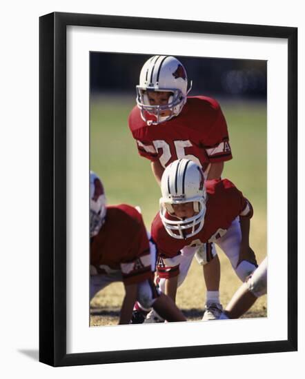 8 Year Old Boys Playing Football-null-Framed Photographic Print