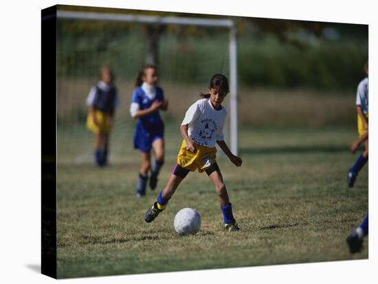 8 Year Old Girl in Action Durring Soccer Game, Lakewood, Colorado, USA-null-Stretched Canvas