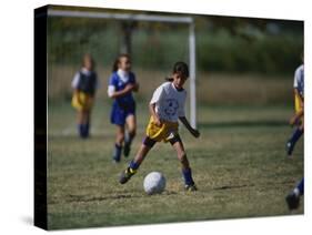 8 Year Old Girl in Action Durring Soccer Game, Lakewood, Colorado, USA-null-Stretched Canvas