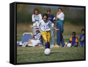 8 Year Old Girl in Action Durring Soccer Game, Lakewood, Colorado, USA-null-Framed Stretched Canvas