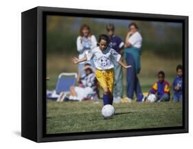 8 Year Old Girl in Action Durring Soccer Game, Lakewood, Colorado, USA-null-Framed Stretched Canvas