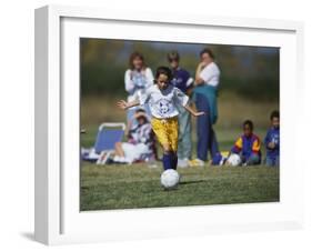 8 Year Old Girl in Action Durring Soccer Game, Lakewood, Colorado, USA-null-Framed Photographic Print