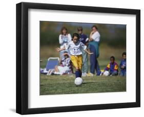 8 Year Old Girl in Action Durring Soccer Game, Lakewood, Colorado, USA-null-Framed Photographic Print